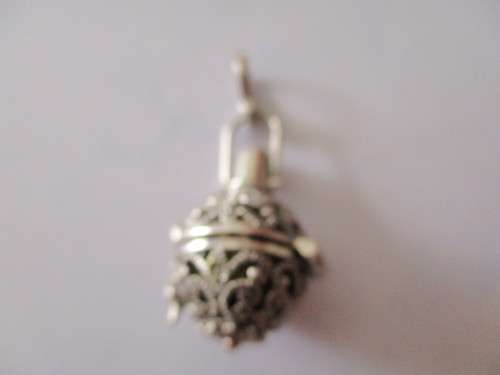 925 Sterling Silver and Garnet `Rattle` Pendant .