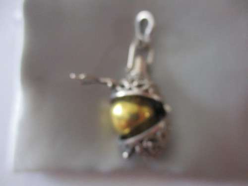 925 Sterling Silver and Garnet `Rattle` Pendant .
