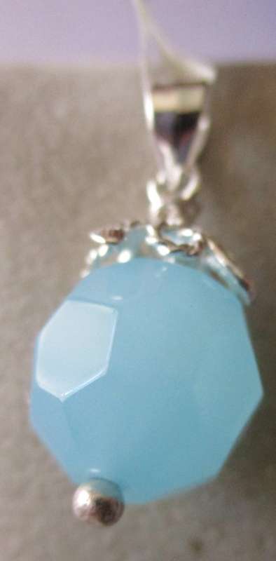 925 Sterling Silver and Blue Topaz Pendant.