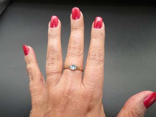 Attractive Blue Topaz & Diamond Ring in 9ct yellow gold