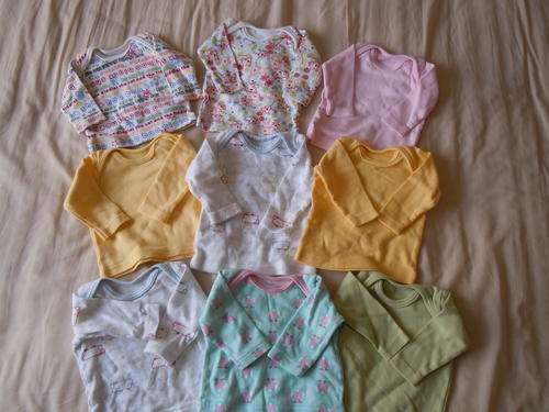 A lot of newborn tops