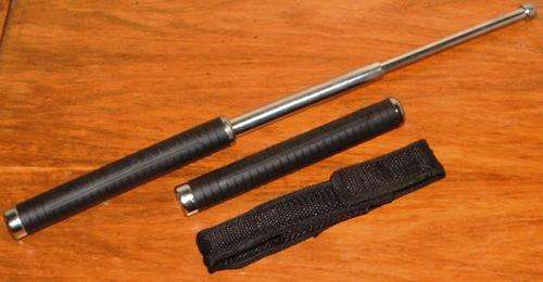 STAINLESS STEEL THREE SECTION TELESCOPIC POLICE BATON WITH RUBBERIZED HANDLE.