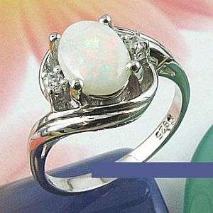 MARYKAY - GORGEOUS WHITE FIRE OPAL SET IN STERLING SLVER RING SIZE 6/M