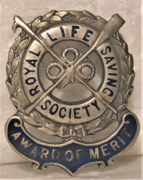 ROYAL LIFE SAVING SOCIETY "AWARD OF MERIT"  BADGE IN GOOD CONDITION WITH LUGS