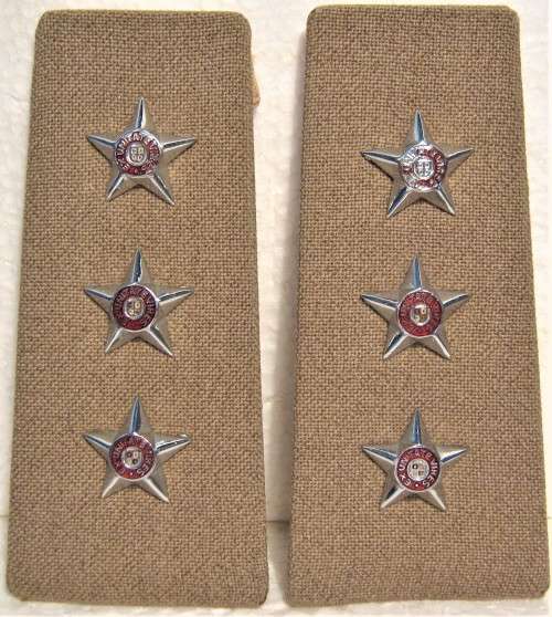 OLD S.A.D.F. ARMY CAPTAINS SLIP ON SHOULDER BOARDS WITH SMALL CHROMED STARS IN A GOOD USED CONDTION