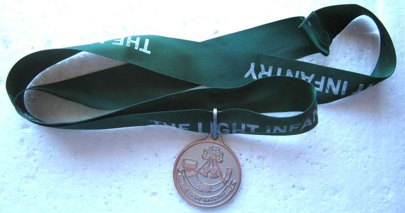 THE LIGHT INFANTRY MEDALLION ON A RIBBON IN VERY GOOD CONDITION
