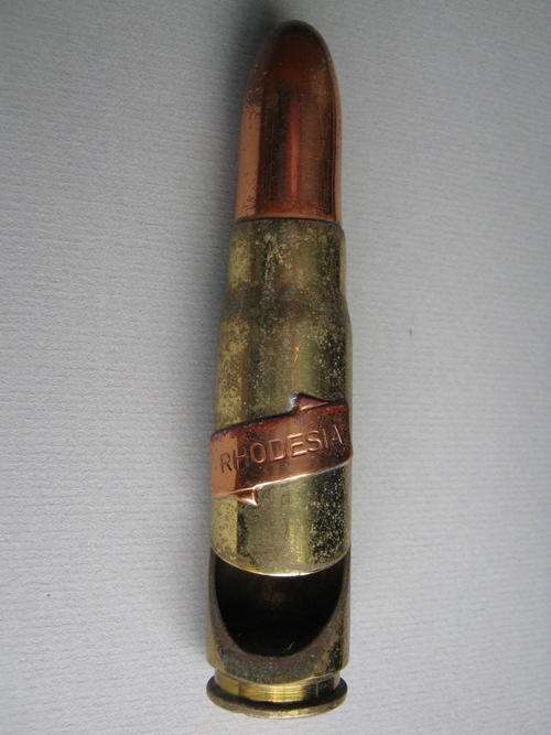 BOTTLE OPENER WITH A "RHODESIA" PLAQUE ON IT MADE FROM A 20mm "doppie"