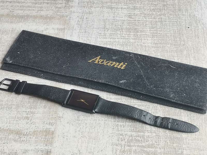 AVANTI ALL BLACK QUARTZ WATCH WITH ORIGINAL DISPLAY CASE IN EXCELLENT WORKING CONDITION
