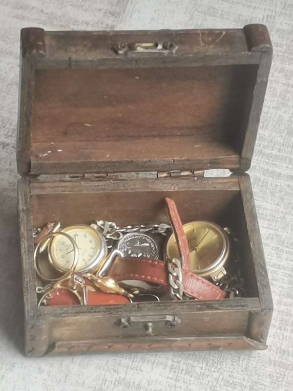 SMALL WOODEN TREASURE CHEST WITH SOME JEWELLERY AND WATCHES