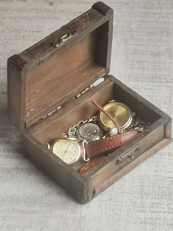 SMALL WOODEN TREASURE CHEST WITH SOME JEWELLERY AND WATCHES