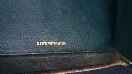 100 year old Bible, leather bound and sewn with silk (dated 1917) with gilt edged pages