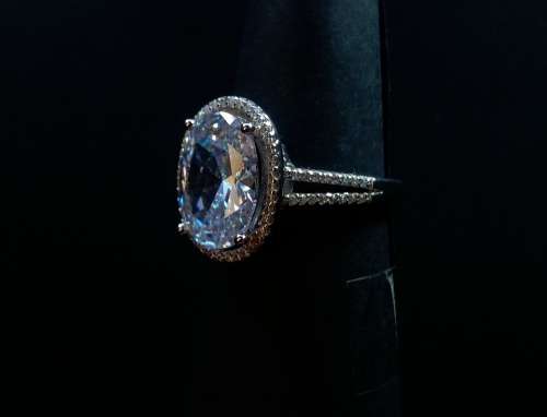 Magnificent 6 CARAT Oval cut Split Shank Simulated Diamond Halo Ring. Size 6