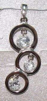 Unusual design... Created DIAMONDS set in Sterling Silver (pendant)