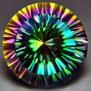 10.70 cts 14.1mm RAINBOW MYSTIC TOPAZ concave round facet (Brazil)