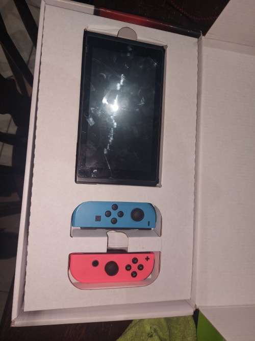 NINTENDO SWITCH WITH DOCKING STATION & CHARGER (RED & BLUE) IN THE BOX!!!!!!