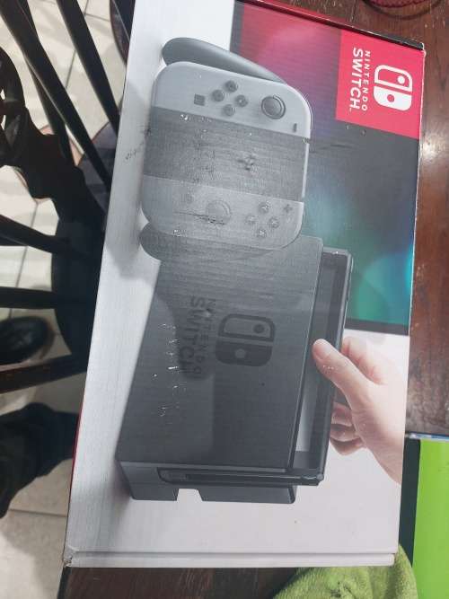 NINTENDO SWITCH WITH DOCKING STATION & CHARGER (RED & BLUE) IN THE BOX!!!!!!