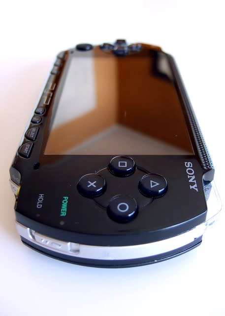 PSP Phat E1004 2gb with 4X games with pouch and charger- portable handheld
