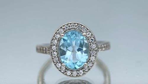 RETAIL:R3500 - NATURAL AQUAMARINE SILVER CZ HALO ETERNITY RING