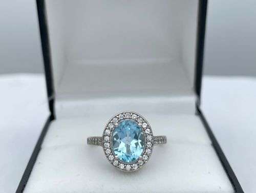 RETAIL:R3500 - NATURAL AQUAMARINE SILVER CZ HALO ETERNITY RING