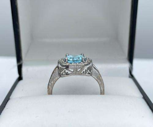 RETAIL:R3500 - NATURAL AQUAMARINE SILVER CZ HALO ETERNITY RING