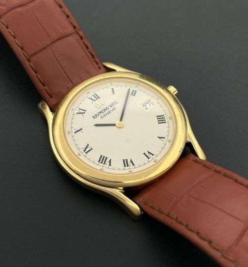 RETAIL:12000- STUNNING RAYMOND WEIL GENEVE COLLECTORS GOLD DRESS WATCH!