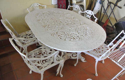 cast iron garden table and 6 chairs