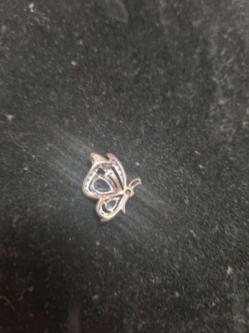 Assorted silver pendants and small silver charms