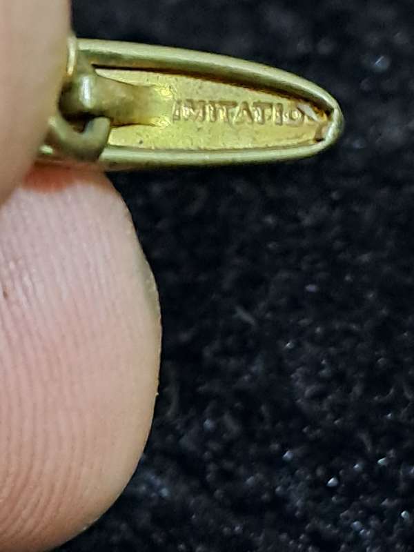 9ct ladies ring with 2 small diamonds and a cubic  and 1 odd cufflink