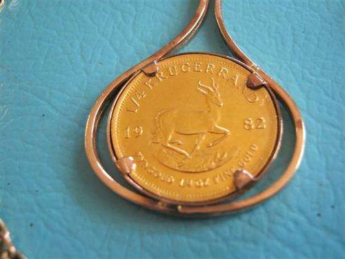 Qtr oz Kruger coin in pendant with Chain (total weight with chain etc +- 26 grs)