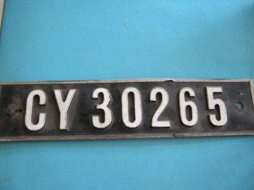 Plastic type number plate with metal backing condition per pic