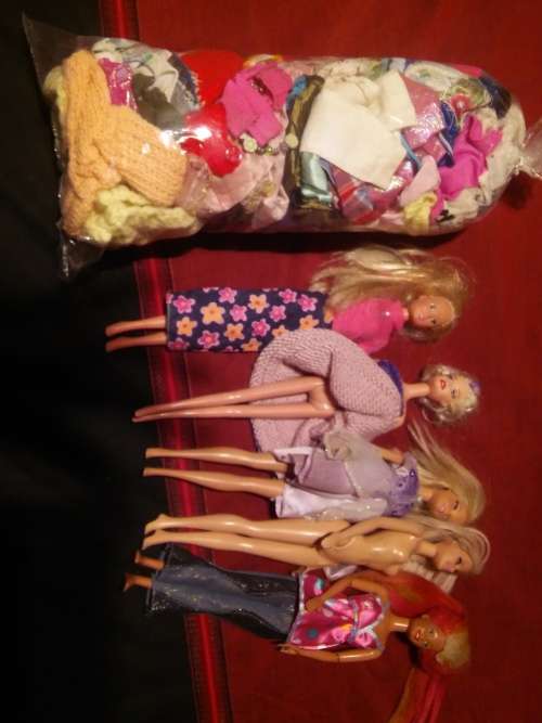 Barbie dolls plus bag of clothes