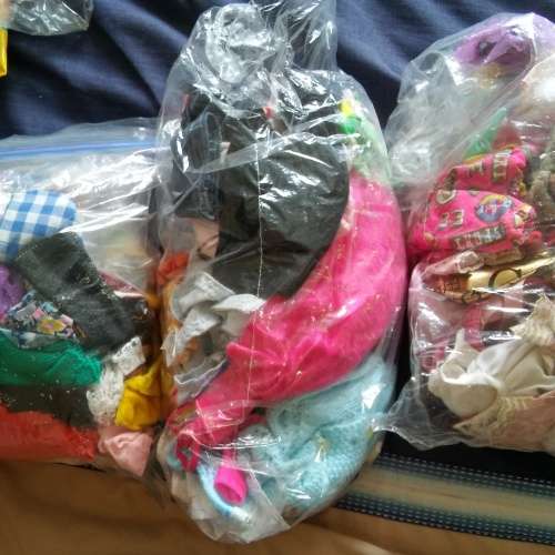 3 bags of barbie clothes / accesories