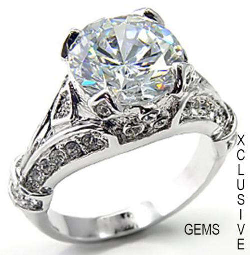 * R35 POSTAGE* 18K WHITE GOLD PLATED SIMULATED DIAMOND LADIES RING