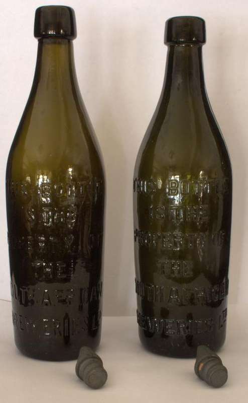 Two original beer bottles (still original screw in caps)