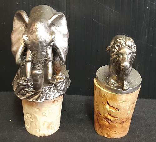 TWO VINTAGE BOTTLE STOPPERS, ONE BID FOR BOTH