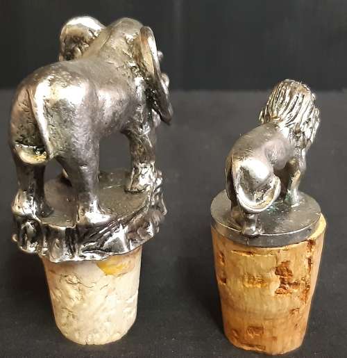 TWO VINTAGE BOTTLE STOPPERS, ONE BID FOR BOTH