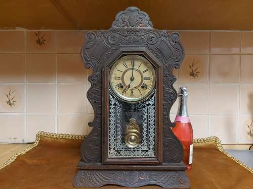 VINTAGE ANSONIA MANTLE CLOCK WITH KEY AND PENDULUM , MADE IN THE USA AND IN A WORKING CONDITION