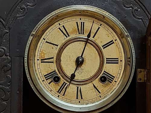 VINTAGE ANSONIA MANTLE CLOCK WITH KEY AND PENDULUM , MADE IN THE USA AND IN A WORKING CONDITION