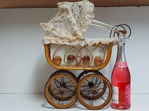 AWESOME! STUNNING VINTAGE ORNATE DESIGN CANE AND STEEL DOLL`S PRAM WITH A LACE BONNET