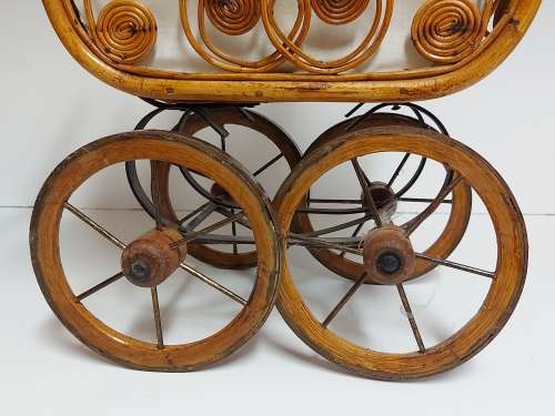 AWESOME! STUNNING VINTAGE ORNATE DESIGN CANE AND STEEL DOLL`S PRAM WITH A LACE BONNET