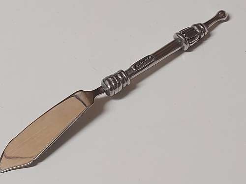 CARROL BOYES FUNCTIONAL ART: VINTAGE PEWTER AND STAINLESS STEEL SPREADER