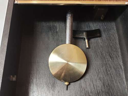 VINTAGE RHYTHM 30 DAY WALL CLOCK IN A WOODEN CASING, WITH KEY AND PENDULUM AND WORKING