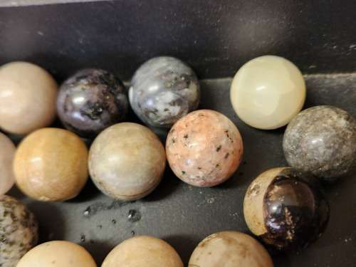COLLECTION OF 37 HIGHLY POLISHED SEMI-PRECIOUS GEMSTONE SPHERES