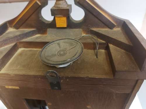 VINTAGE RHYTHM BATTERY STRIKE WALL CLOCK IN A WOODEN CASING WITH A PENDULUM, NOT TESTED