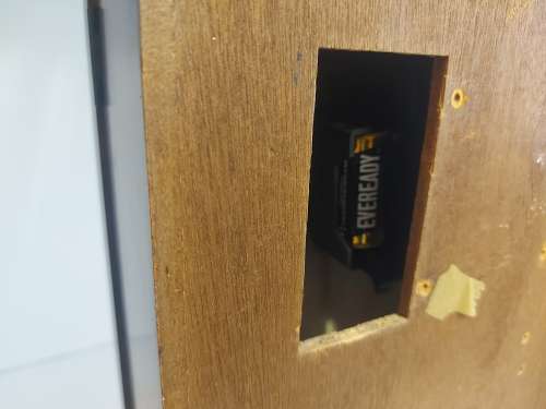 VINTAGE RHYTHM BATTERY STRIKE WALL CLOCK IN A WOODEN CASING WITH A PENDULUM, NOT TESTED