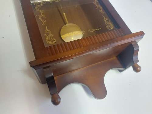 VINTAGE RHYTHM BATTERY STRIKE WALL CLOCK IN A WOODEN CASING WITH A PENDULUM, NOT TESTED