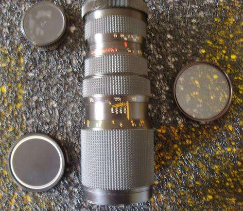 CAMERA LENS - AUTO PROMASTER MC ZOOM 85-210mm. WITH A QUANTARAY 62MM UV FILTER