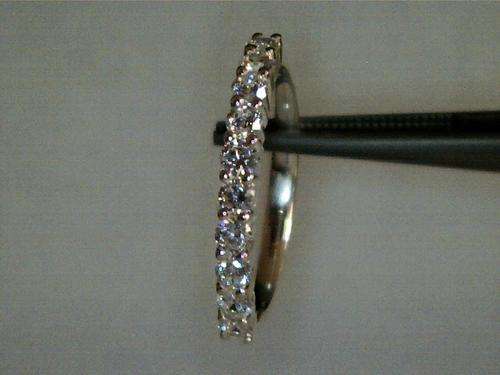 Sterling quarter silver eternity ring with cubic zirconia stones, size T. New hallmarked!