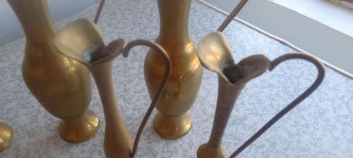 A Collection Of Brass Jugs With Handles