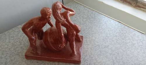 Stunning Solid Sculpture of Woman and Guy with Ball